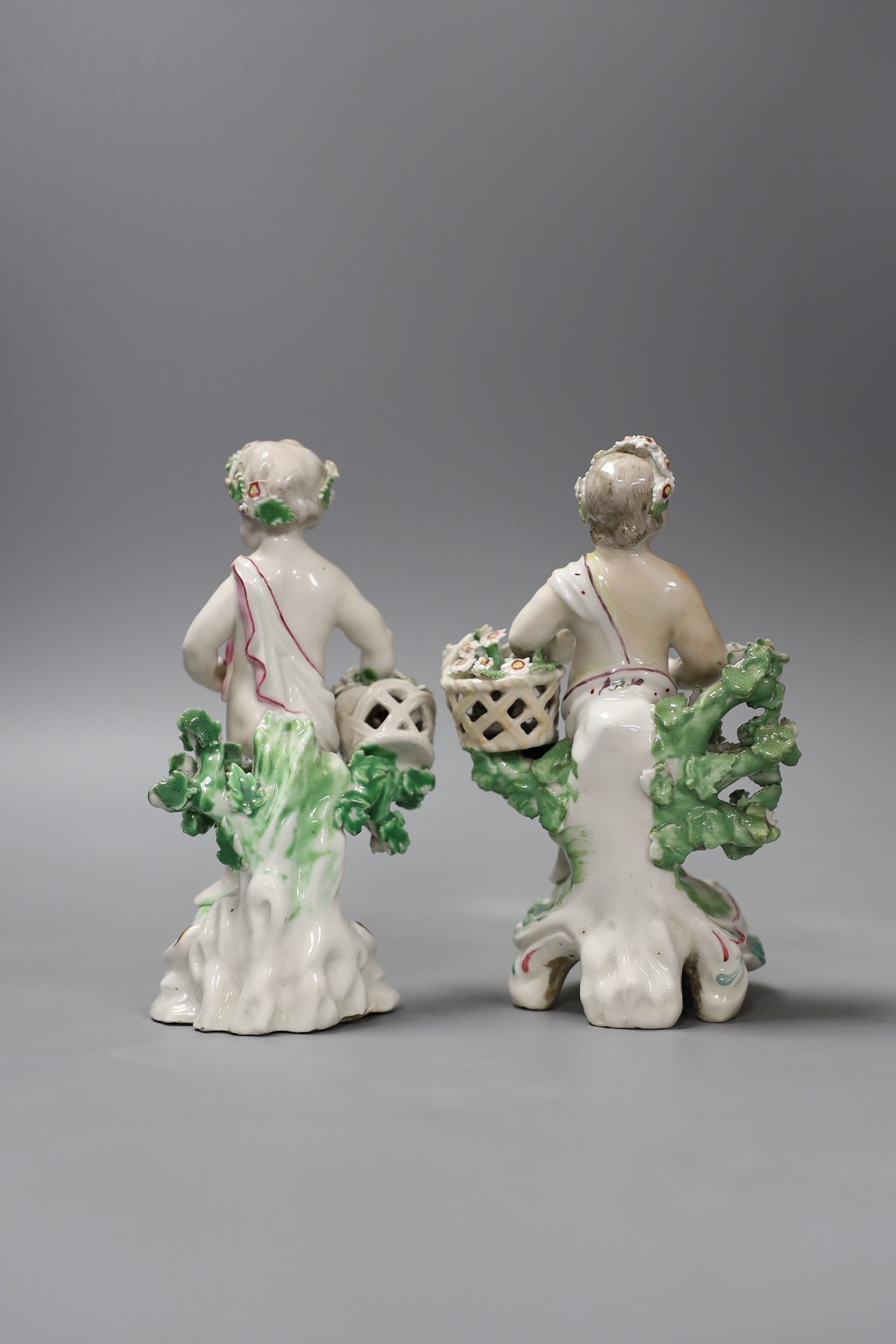 A pair of late 18th century Derby putti, 13 cms high